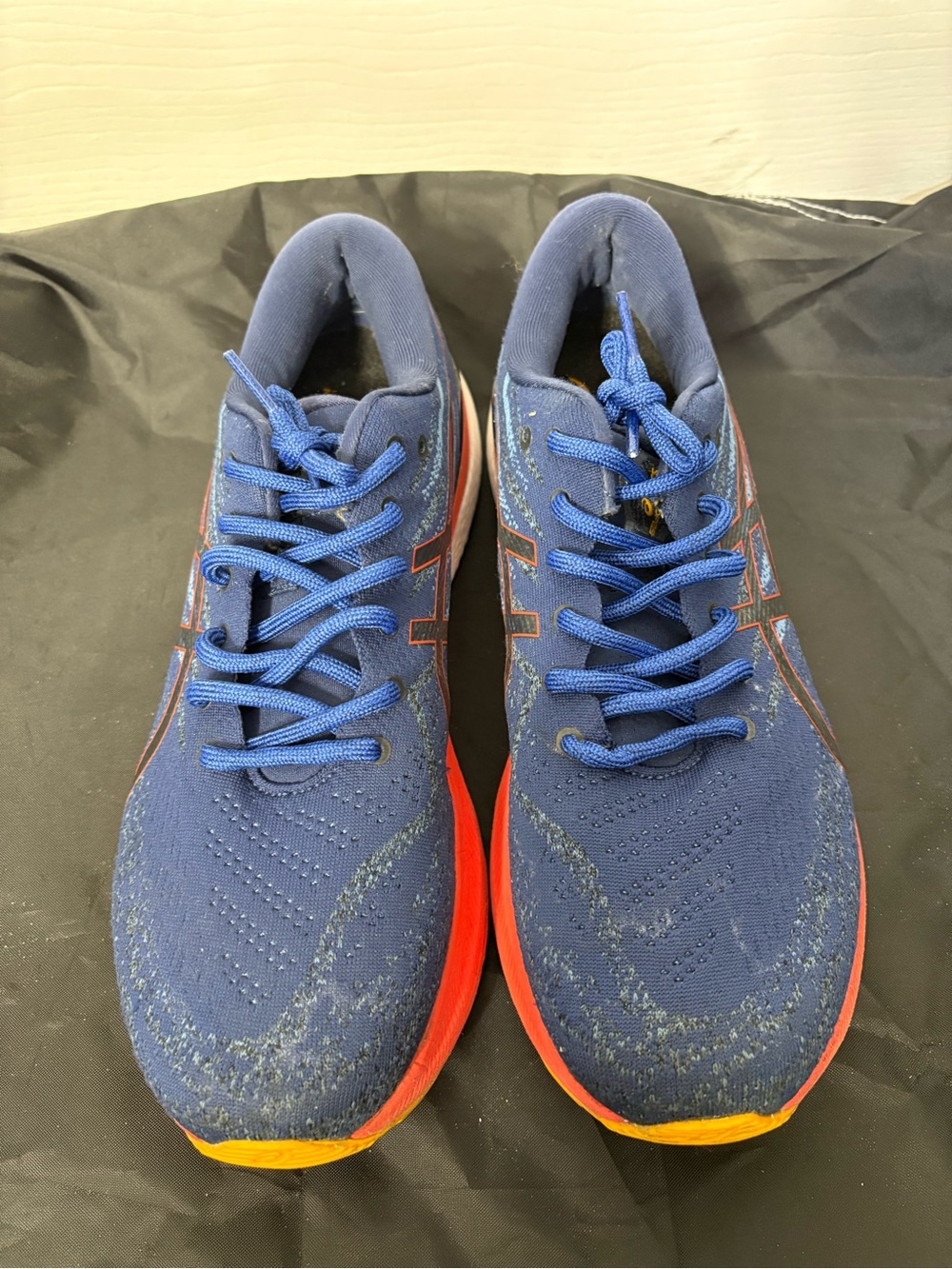 Asics Men's Blue Athletic Running Shoes with Red and Yellow Accents